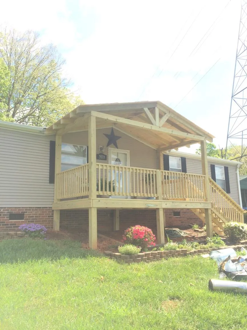 New gabled porch roof and deck railing added to a ranch home in Auburn